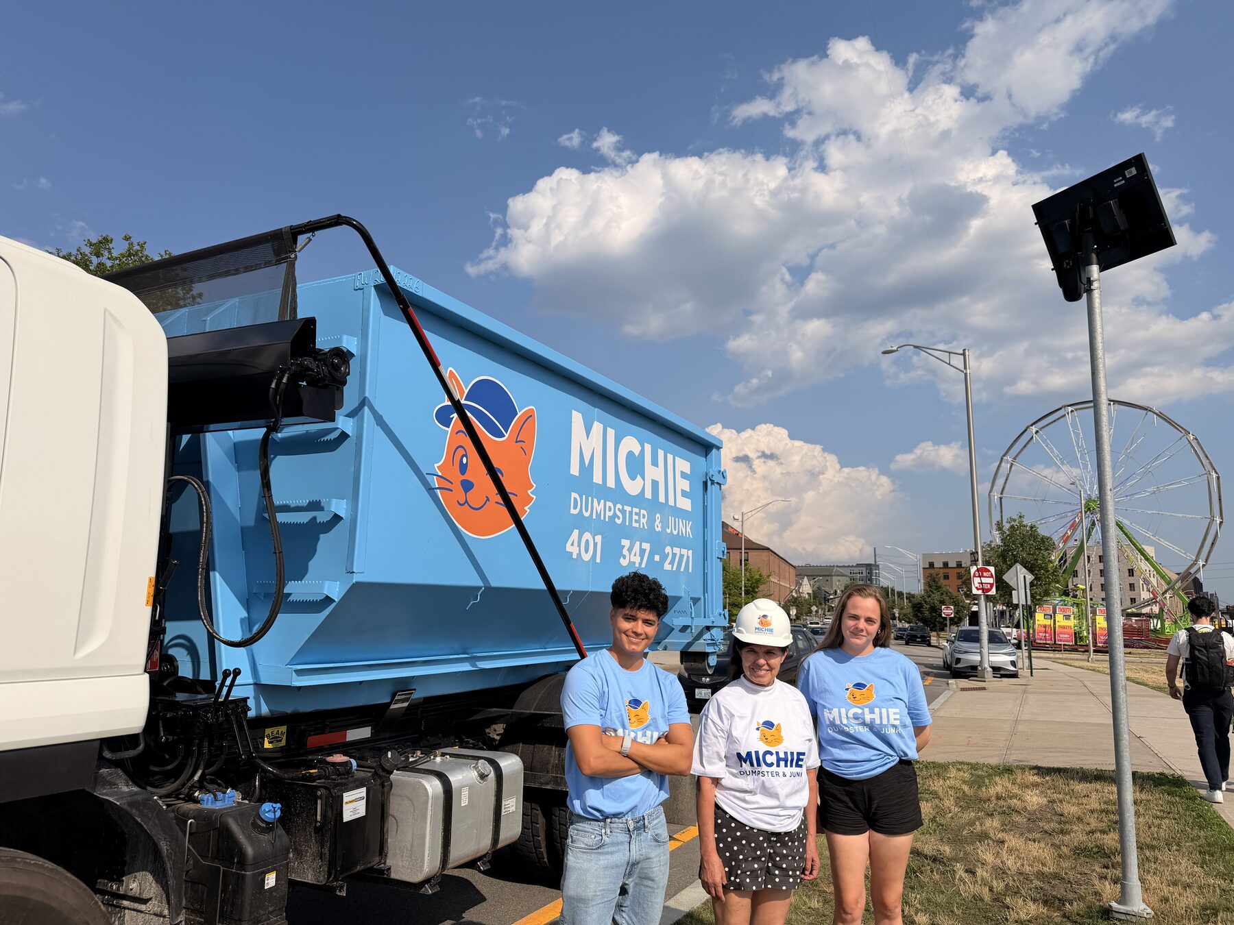 The Michie Dumpster & Junk team with a delivery truck in Providence, RI